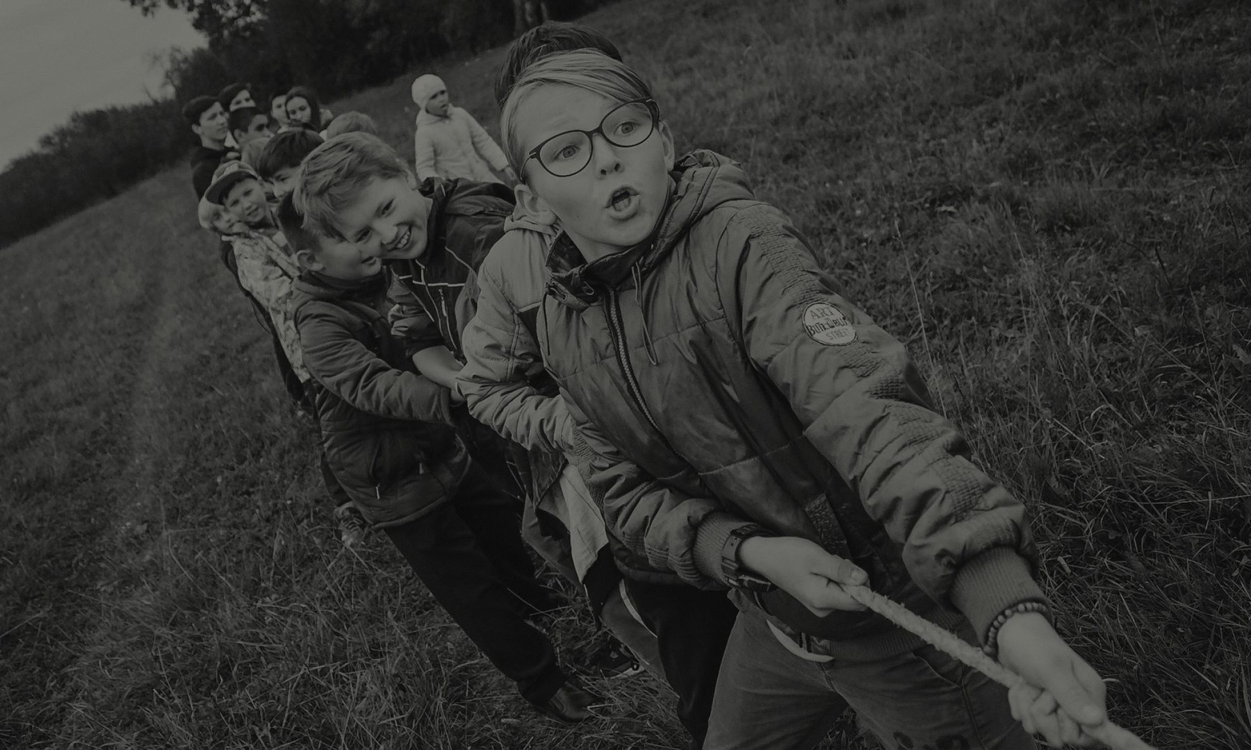 Children pulling together on a rope
